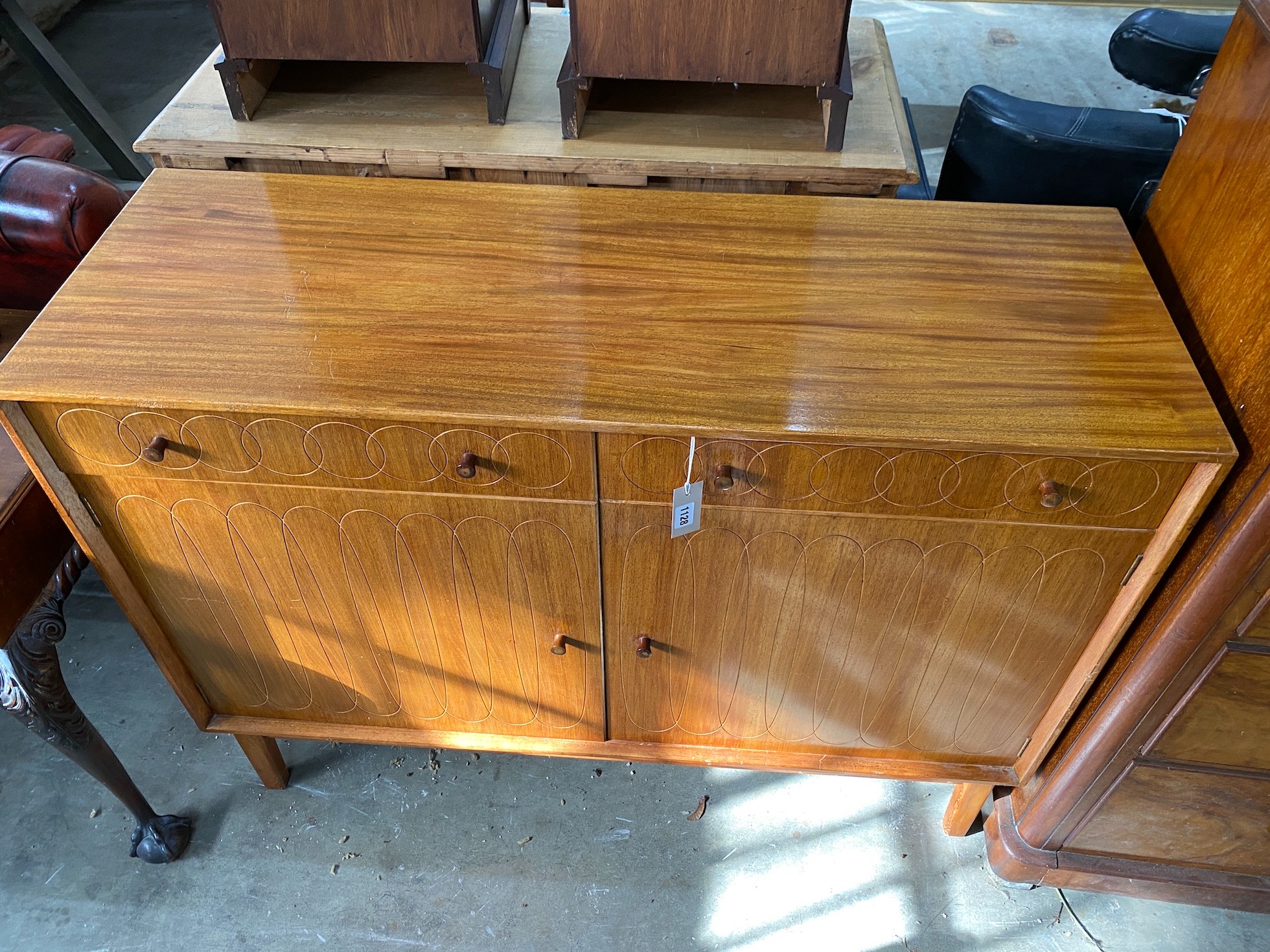 A mid century teak sideboard, length 122cm, depth 43cm, height 91cm